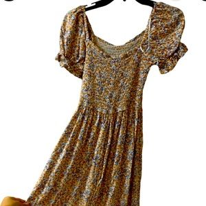 a long multi color dress with a slit on the side